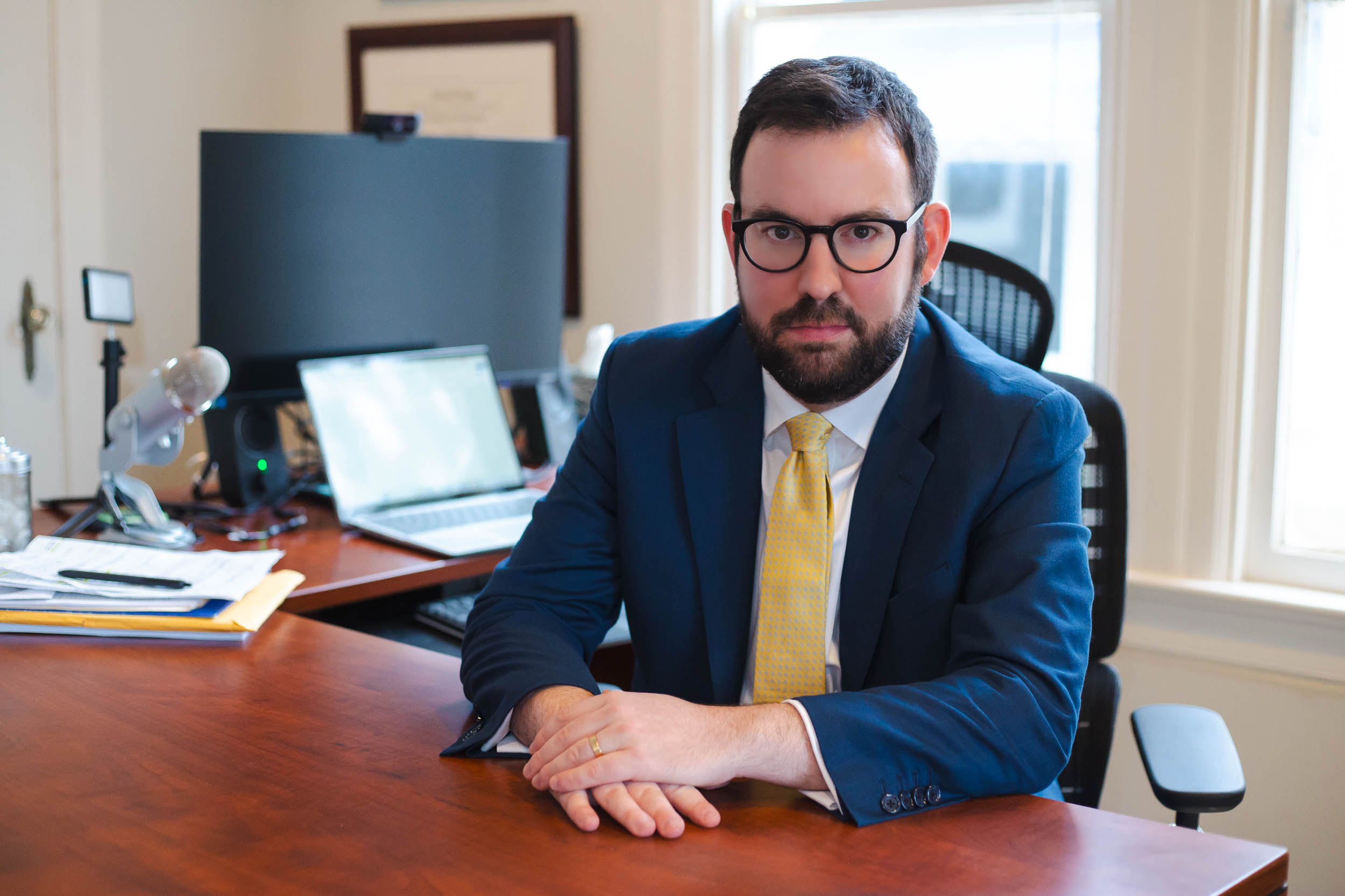 Attorney desk with legal documents and computer